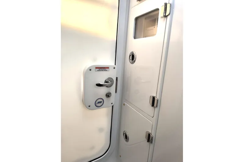 Slide: The Image of 2019 HCB 39 Speciale cabin door with chrome handle and secure locking mechanism. - 35
