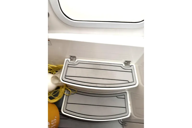 Slide: The Image of 2019 HCB 39 Speciale boat steps with rope and buoy nearby. - 36