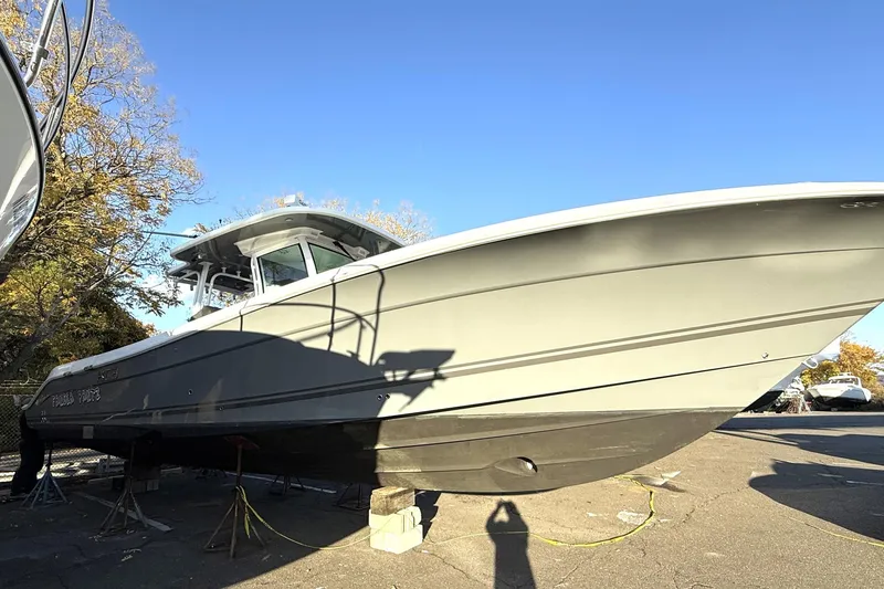 Slide: The Image of 2019 HCB 39 Speciale boat on dry dock under clear blue sky. - 42