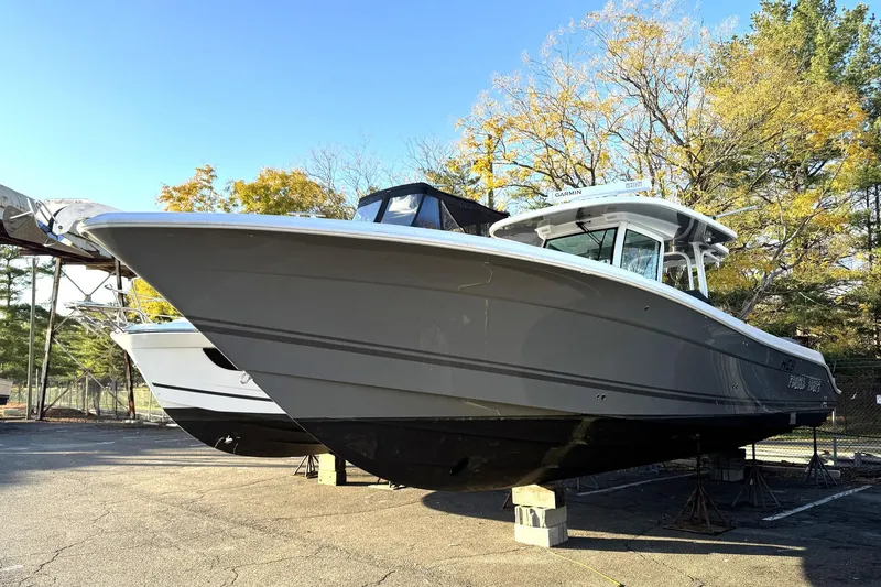Slide: The Image of 2019 HCB 39 Speciale boat on stands, surrounded by autumn trees and clear blue sky. - 43