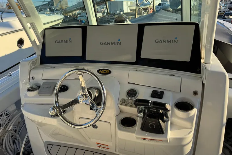 Slide: The Image of Helm of 2019 HCB 39 Speciale with Garmin displays and Yamaha controls. - 5