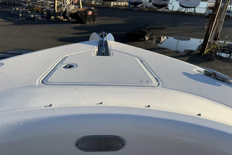 Slide: The Image of Bow view of 2019 HCB 39 Speciale boat in a marina setting. - 6
