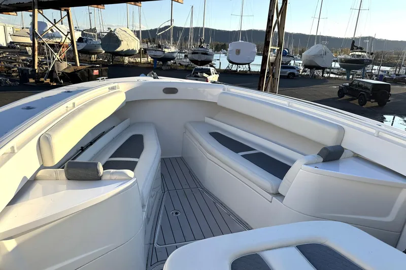 Slide: The Image of 2019 HCB 39 Speciale boat interior with white seating, docked at marina. - 7