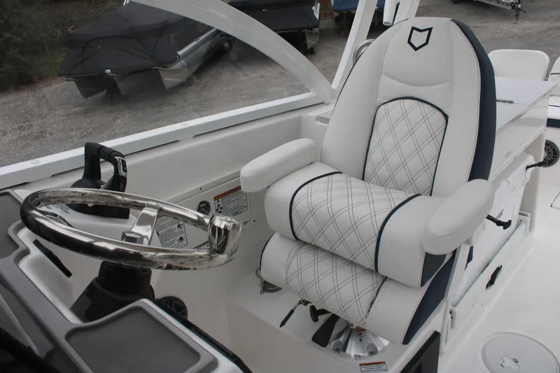 Slide: The Image of 2026 Sea Fox 268 Traveler boat cockpit with luxurious captain's chair and steering wheel. - 10