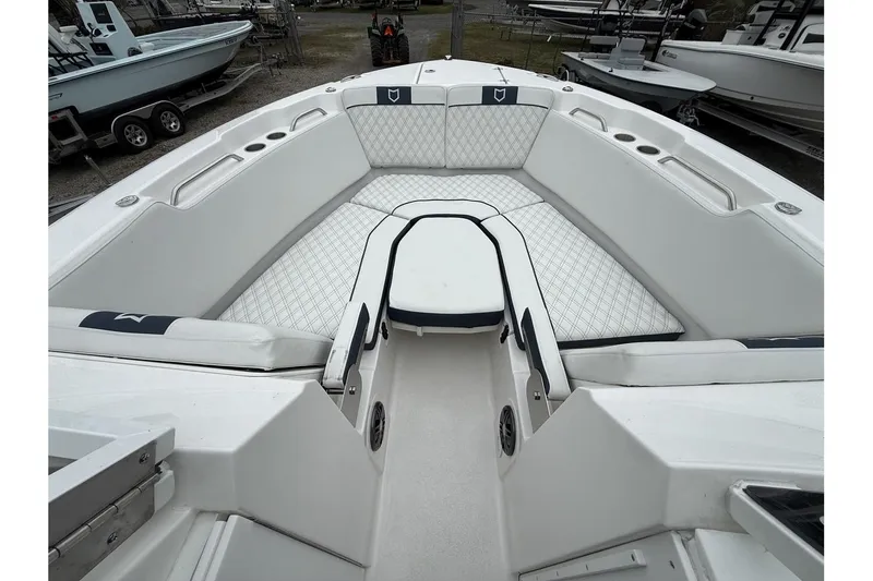 Slide: The Image of 2026 Sea Fox 268 Traveler boat interior with cushioned seating and cup holders. - 13