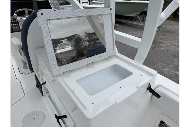 Slide: The Image of 2026 Sea Fox 268 Traveler boat interior with open storage compartment and reflective lid. - 16