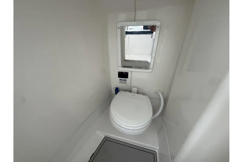 Slide: The Image of 2026 Sea Fox 268 Traveler boat bathroom with toilet and mirror. - 17