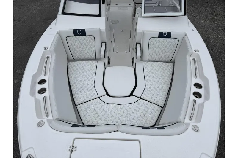 Slide: The Image of 2026 Sea Fox 268 Traveler boat interior with cushioned seating and cup holders. - 19