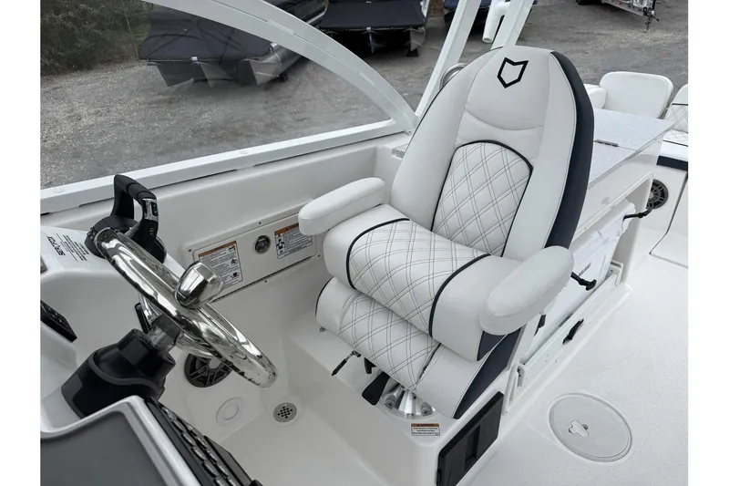 Slide: The Image of Luxury helm seat on 2026 Sea Fox 268 Traveler boat, featuring elegant design and steering wheel. - 21