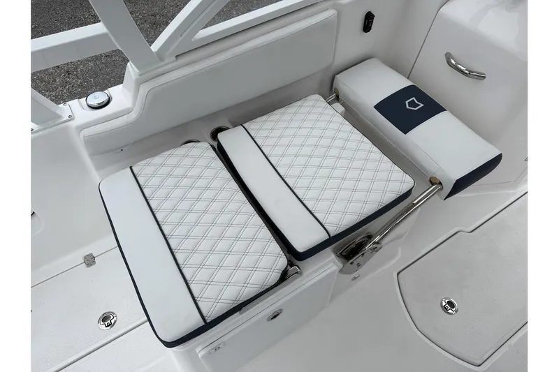 Slide: The Image of 2026 Sea Fox 268 Traveler boat seating with white and navy cushioned design. - 23