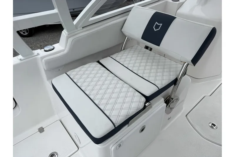 Slide: The Image of 2026 Sea Fox 268 Traveler boat seat with white and navy upholstery. - 24