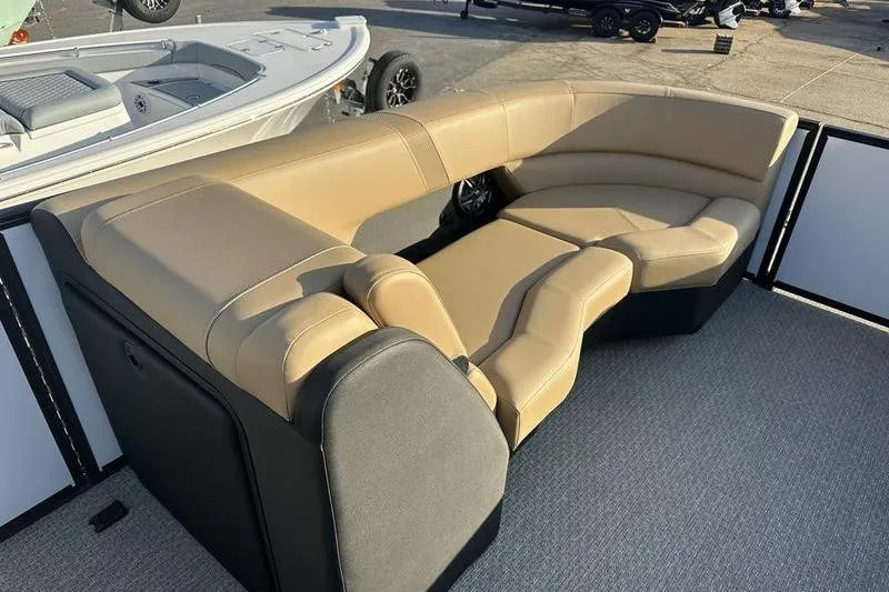 Slide: The Image of Luxurious seating on 2026 Evotti 523CS boat, featuring tan and black upholstery. - 10
