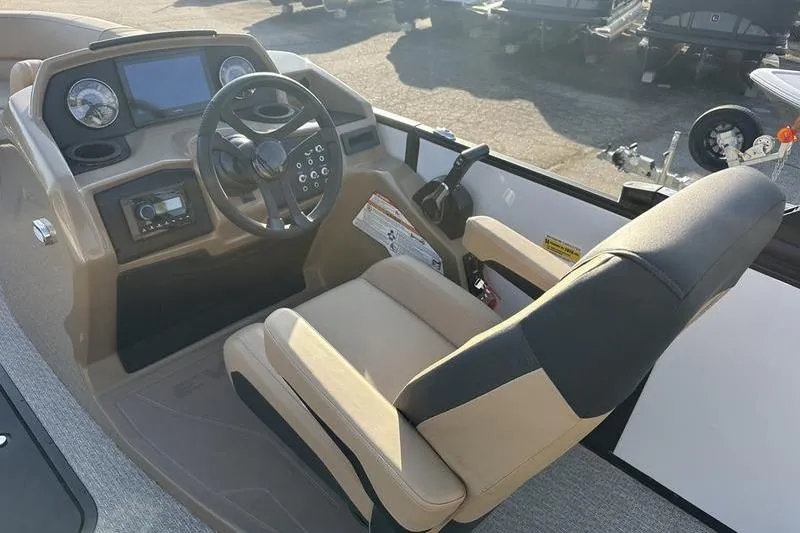 Slide: The Image of Interior of 2026 Evotti 523CS boat, featuring steering wheel and control panel. - 12