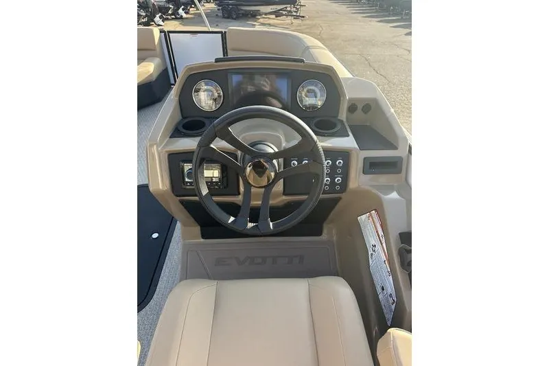 Slide: The Image of 2026 Evotti 523CS boat dashboard with steering wheel and control panel. - 14