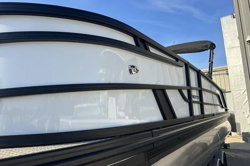 Slide: The Image of 2026 Evotti 523CS pontoon boat with sleek black and white design. - 8