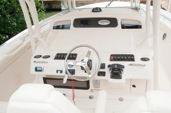 Slide: The Image of Manufacturer Provided Image: 2016 Grady-White Canyon 336 boat helm with steering wheel and control panel. - 10