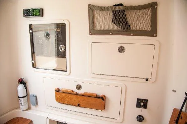 Slide: The Image of Manufacturer Provided Image: 2016 Grady-White Canyon 336 interior control panel and storage compartments. - 16