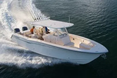 Slide: The Image of Manufacturer Provided Image: 2016 Grady-White Canyon 336 boat cruising on water. - 6