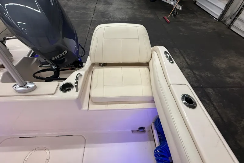 Slide: The Image of 2023 Grady-White Fisherman 216 boat interior with seating and motor detail. - 14