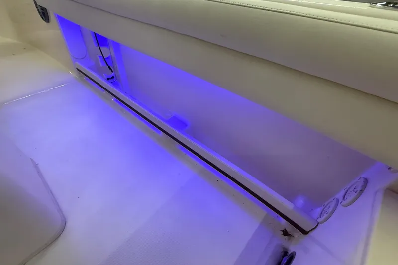 Slide: The Image of 2023 Grady-White Fisherman 216 boat interior with blue LED lighting. - 26
