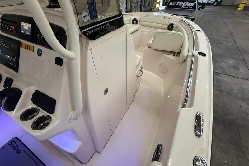 Slide: The Image of 2023 Grady-White Fisherman 216 boat interior with modern dashboard and seating. - 30