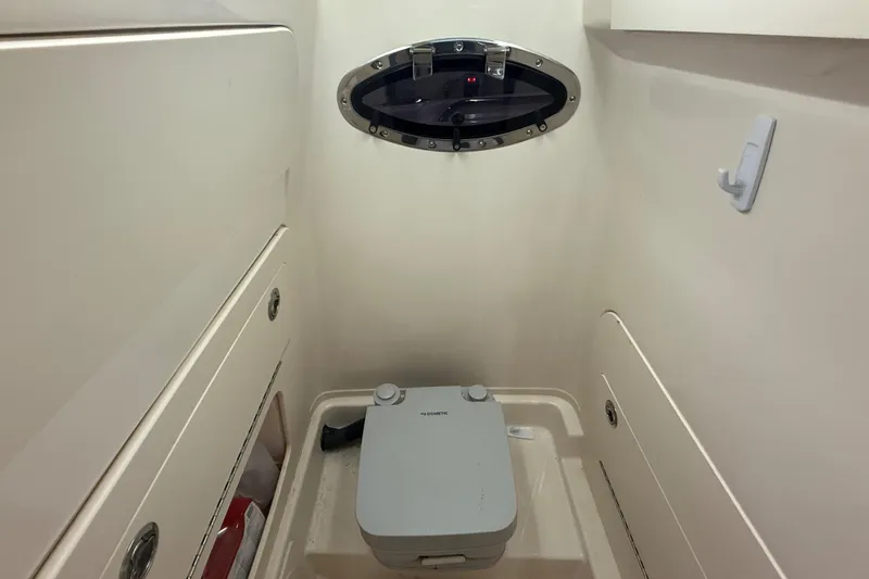 Slide: The Image of 2023 Grady-White Fisherman 216 boat interior with compact marine toilet. - 31