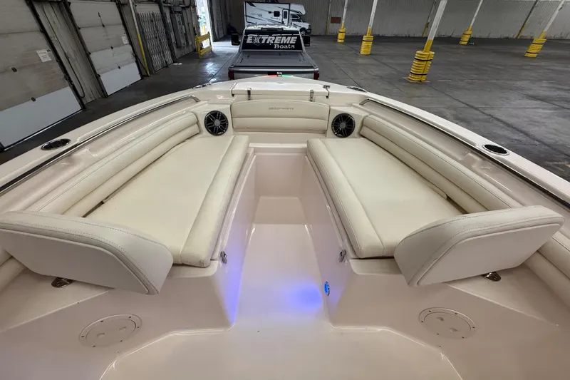 Slide: The Image of 2023 Grady-White Fisherman 216 boat interior with cushioned seating and ambient lighting. - 33