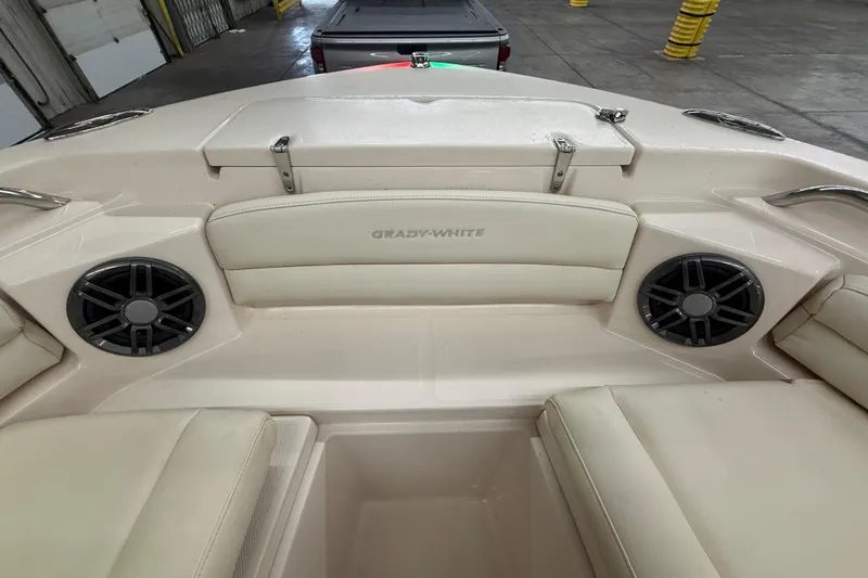 Slide: The Image of 2023 Grady-White Fisherman 216 boat interior with speakers and cushioned seating. - 35