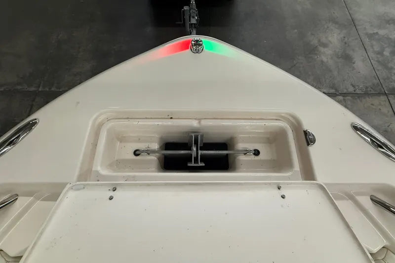 Slide: The Image of 2023 Grady-White Fisherman 216 boat bow with anchor compartment, indoors. - 36