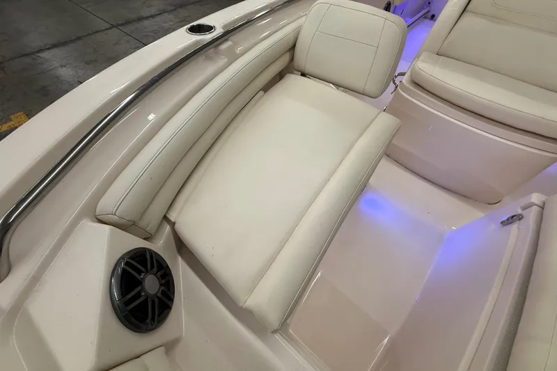 Slide: The Image of 2023 Grady-White Fisherman 216 boat interior with cushioned seating and speaker. - 37