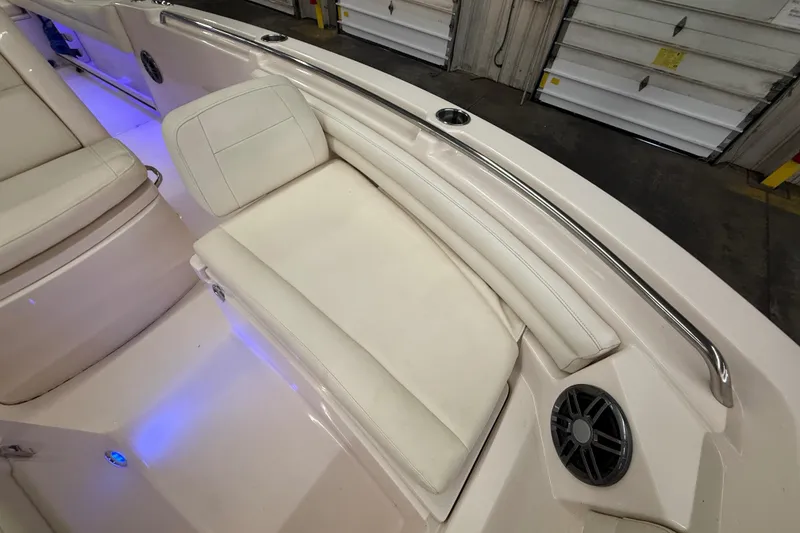 Slide: The Image of 2023 Grady-White Fisherman 216 boat interior with cushioned seating and speaker. - 39