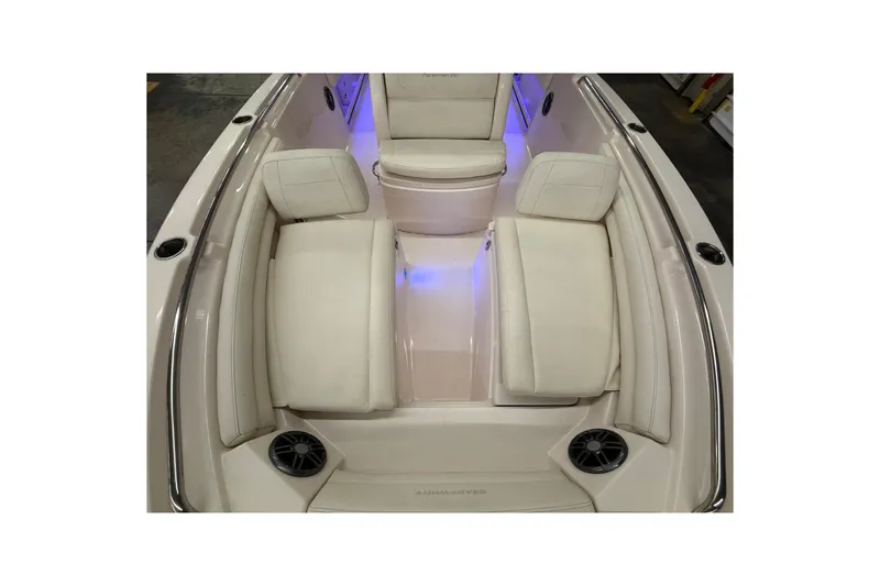 Slide: The Image of 2023 Grady-White Fisherman 216 boat interior with white seating and blue ambient lighting. - 40