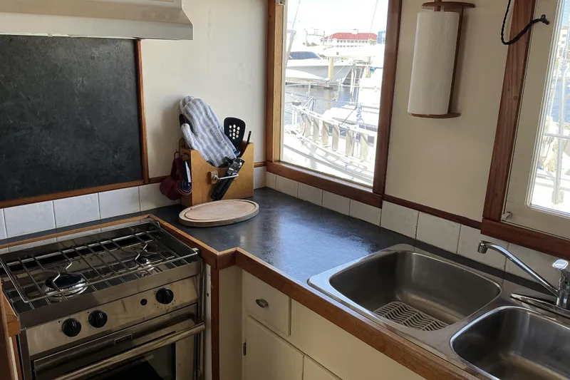 Slide: The Image of Pilothouse trawler kitchen with stove, sink, and utensils, 2009 Hugh Huff Custom model. - 24