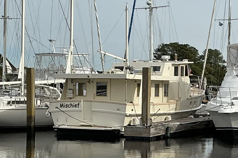 Slide: The Image of 2009 Hugh Huff Custom Pilothouse Trawler "Mischief" docked at marina. - 3