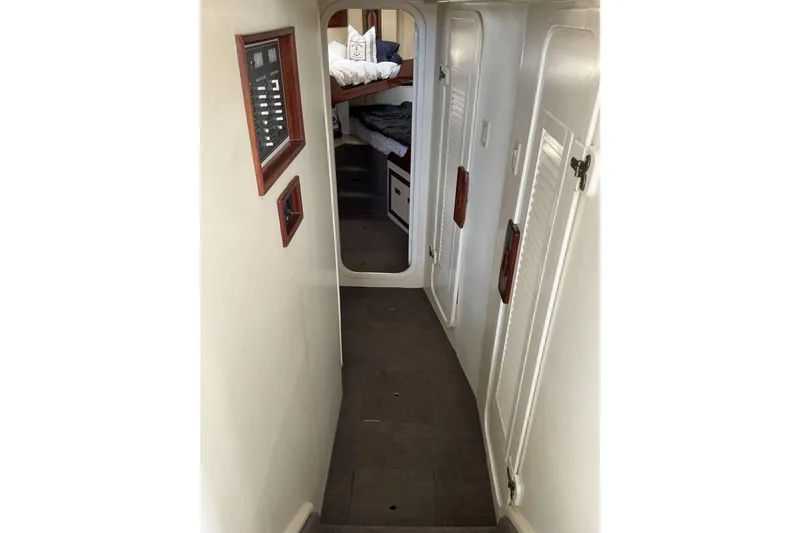 Slide: The Image of Interior hallway of 2009 Hugh Huff Custom Pilothouse Trawler with visible bunk beds. - 34