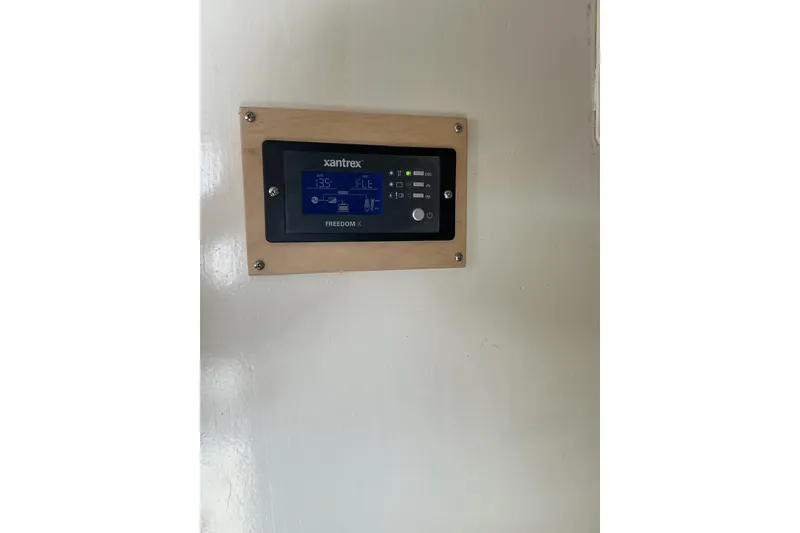 Slide: The Image of Xantrex Freedom X control panel on 2009 Hugh Huff Custom Pilothouse Trawler. - 35