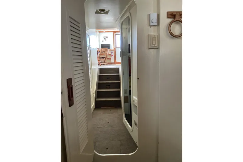Slide: The Image of Interior hallway of 2009 Hugh Huff Custom Pilothouse Trawler with stairs and wooden accents. - 39