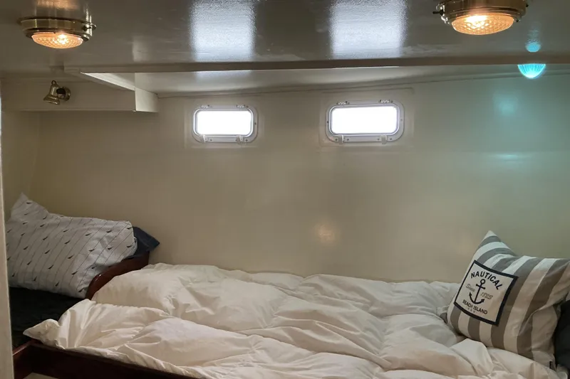 Slide: The Image of Cozy cabin interior of 2009 Hugh Huff Custom Pilothouse Trawler with nautical decor. - 45
