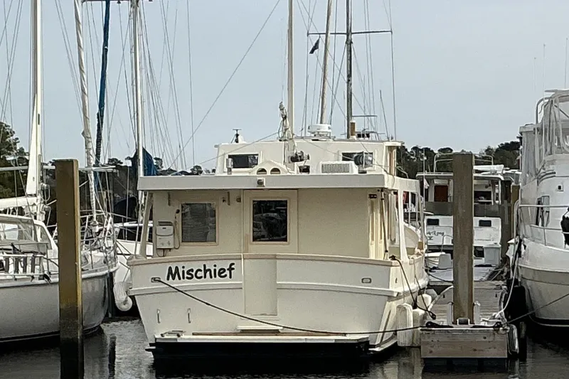 Slide: The Image of 2009 Hugh Huff Custom Pilothouse Trawler "Mischief" docked at marina. - 5