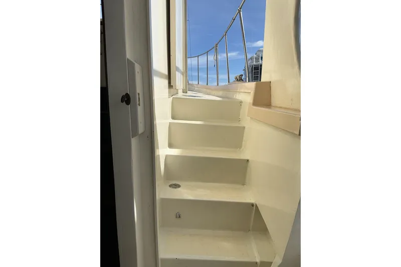 Slide: The Image of Staircase on 2009 Hugh Huff Custom Pilothouse Trawler, leading to deck with railing. - 7