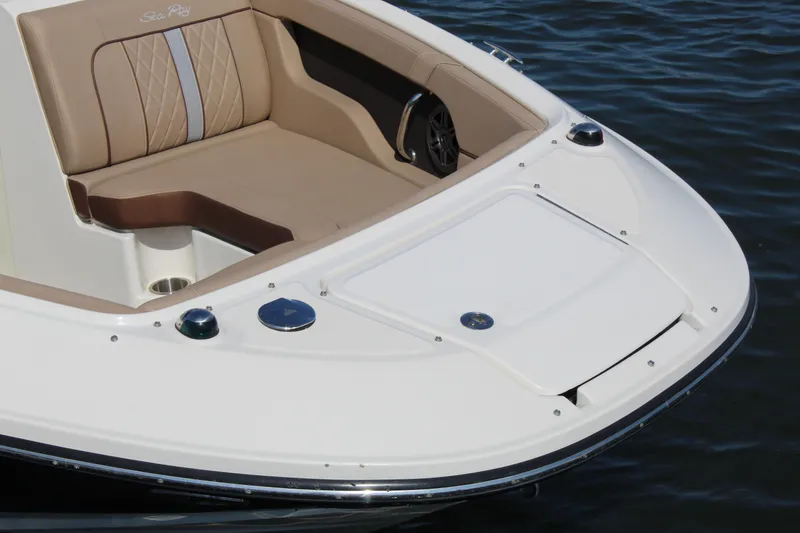 Slide: The Image of 2016 Sea Ray SunDeck 220 boat with beige seating on calm water. - 16