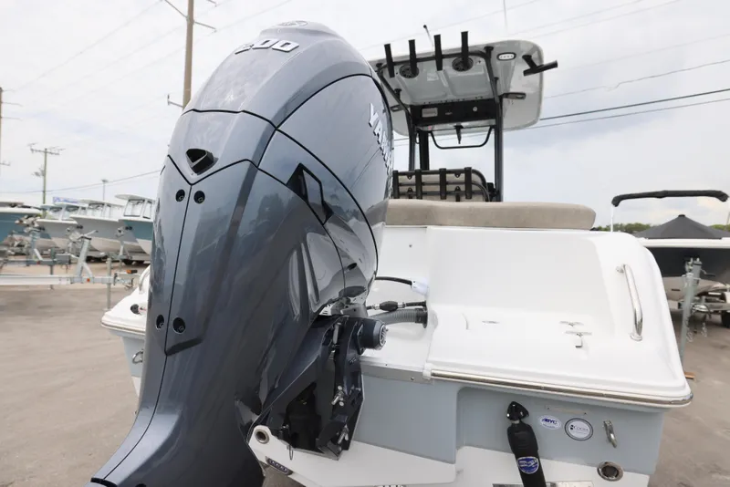 Slide: The Image of 2026 Sea Hunt Ultra 235 SE boat with Yamaha outboard motor, docked at marina. - 10