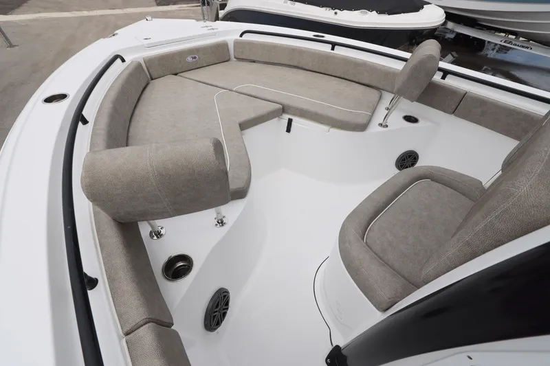 Slide: The Image of 2026 Sea Hunt Ultra 235 SE boat interior with cushioned seating and modern design. - 15