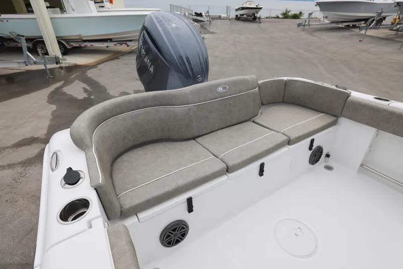Slide: The Image of 2026 Sea Hunt Ultra 235 SE boat interior with cushioned seating and Yamaha engine. - 5