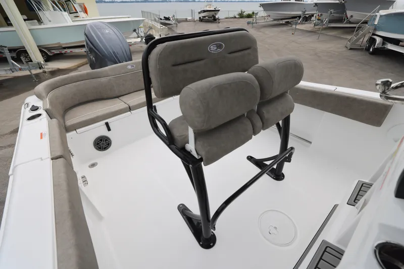 Slide: The Image of 2026 Sea Hunt Ultra 235 SE boat interior with cushioned seating and sleek design. - 7