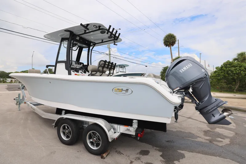 Slide: The Image of 2026 Sea Hunt Ultra 235 SE boat on trailer with Yamaha outboard motor. - 9