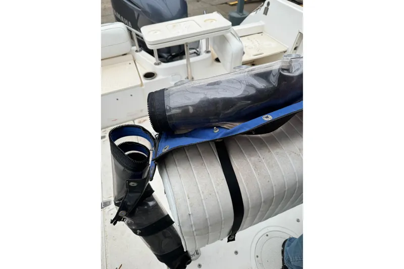 Slide: The Image of 1999 Boston Whaler 21 Outrage boat interior with Yamaha engine and protective cover. - 8