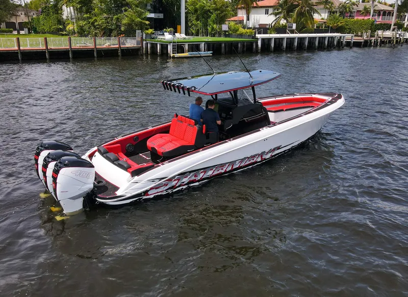 Slide: The Image of 2020 Statement 380 Open boat on water with red interior. - 34