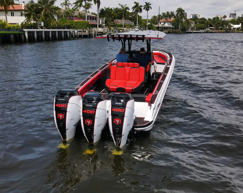 Slide: The Image of 2020 Statement 380 Open boat with triple outboard engines on the water. - 35