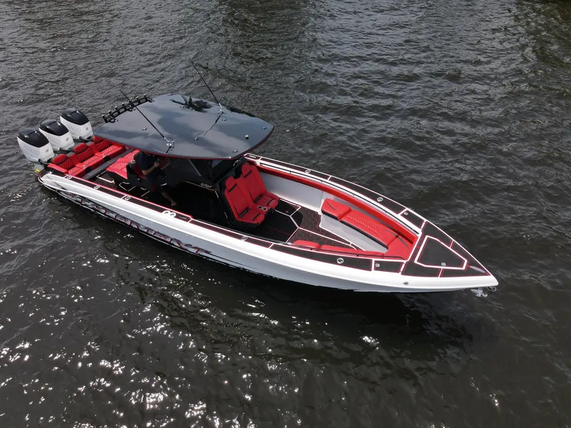 Slide: The Image of 2020 Statement 380 Open boat on water, red and black details. - 38